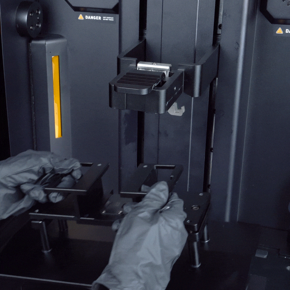 GIF showing the build plate hung inside the printer to drain excess resin back into the vat.